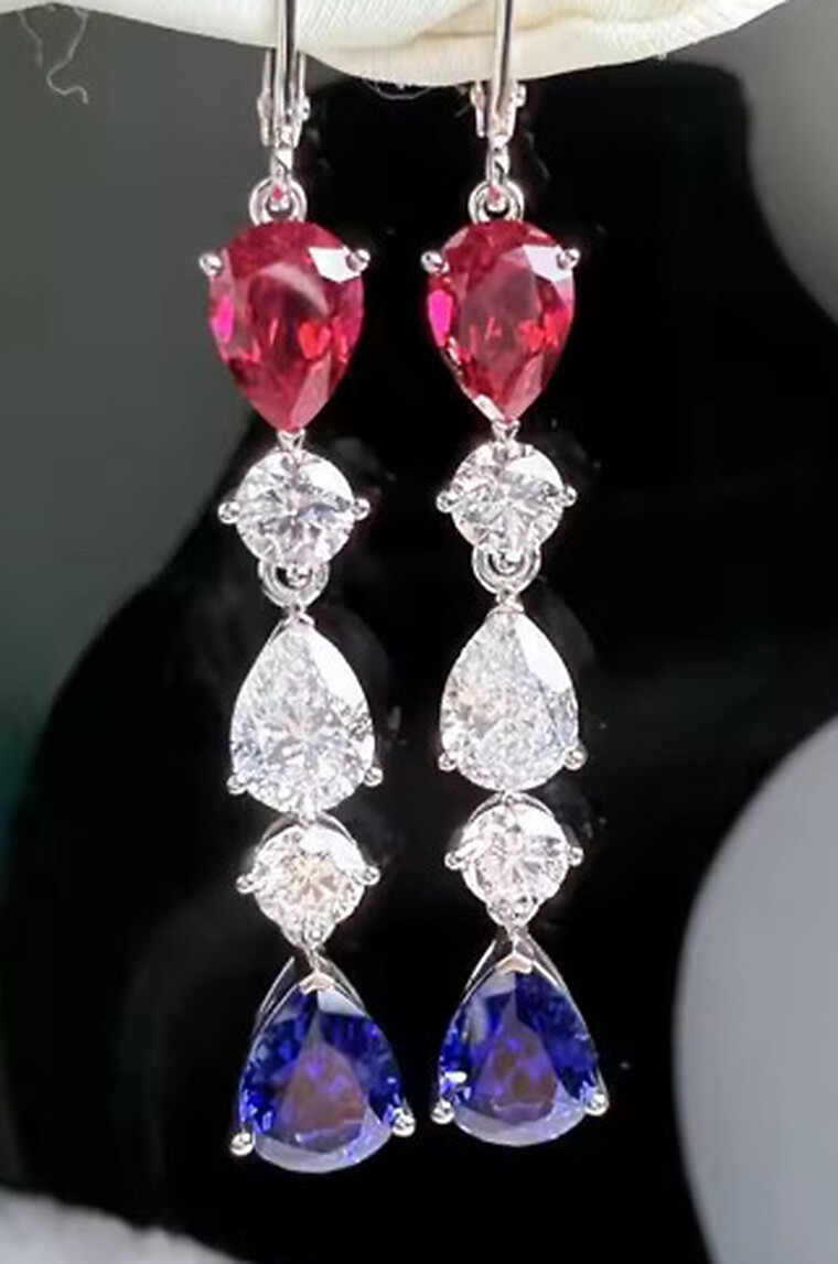 The Americana drop earrings — a lab-created ruby, lab-grown diamond and lab-created sapphire teardrop cascade in 14K white gold French-hook drops, shown as a pair