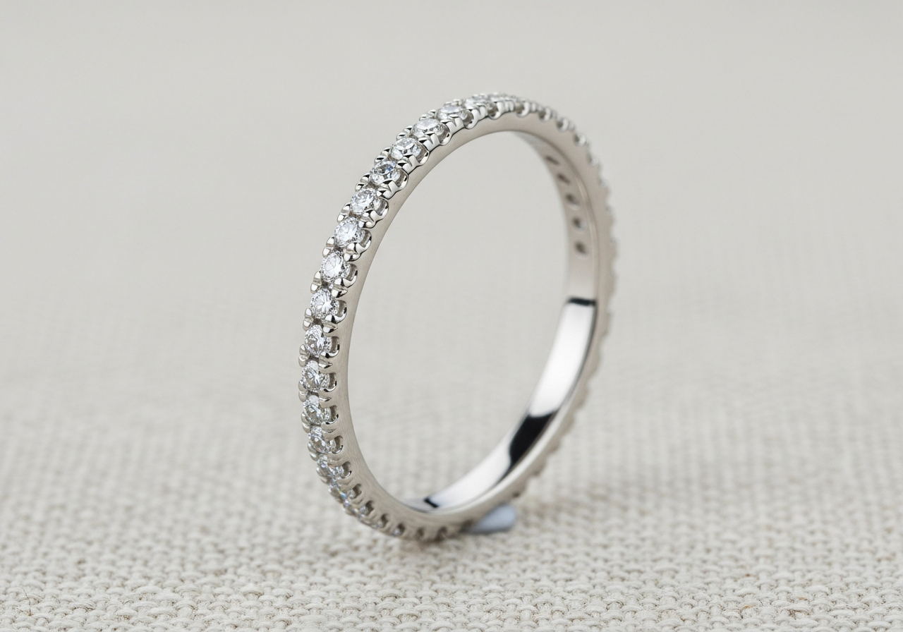 Delicate pavé 1.8mm 18k white gold wedding band micro-pavé set with 0.25 ct of lab-grown round brilliant diamonds across the top